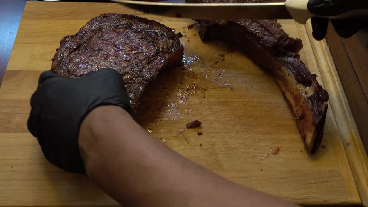 Cowboy Rib-eye steak being cut