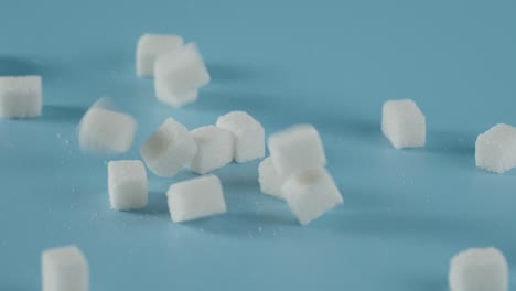 sugar cubes fall on the table.