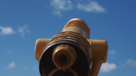 Low-Angle-View-Of-Yellow-Coin-operated-Telescope-On-The-Coast-Of-San-Diego-In-California,-USA