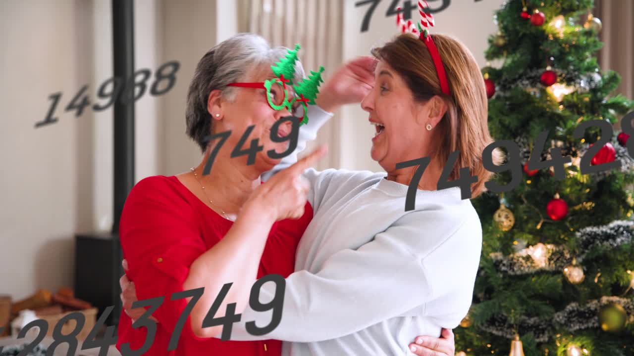 Mom and daughter hugging after wave at Xmas tree, antlers, numbers drifting over faces for ads
