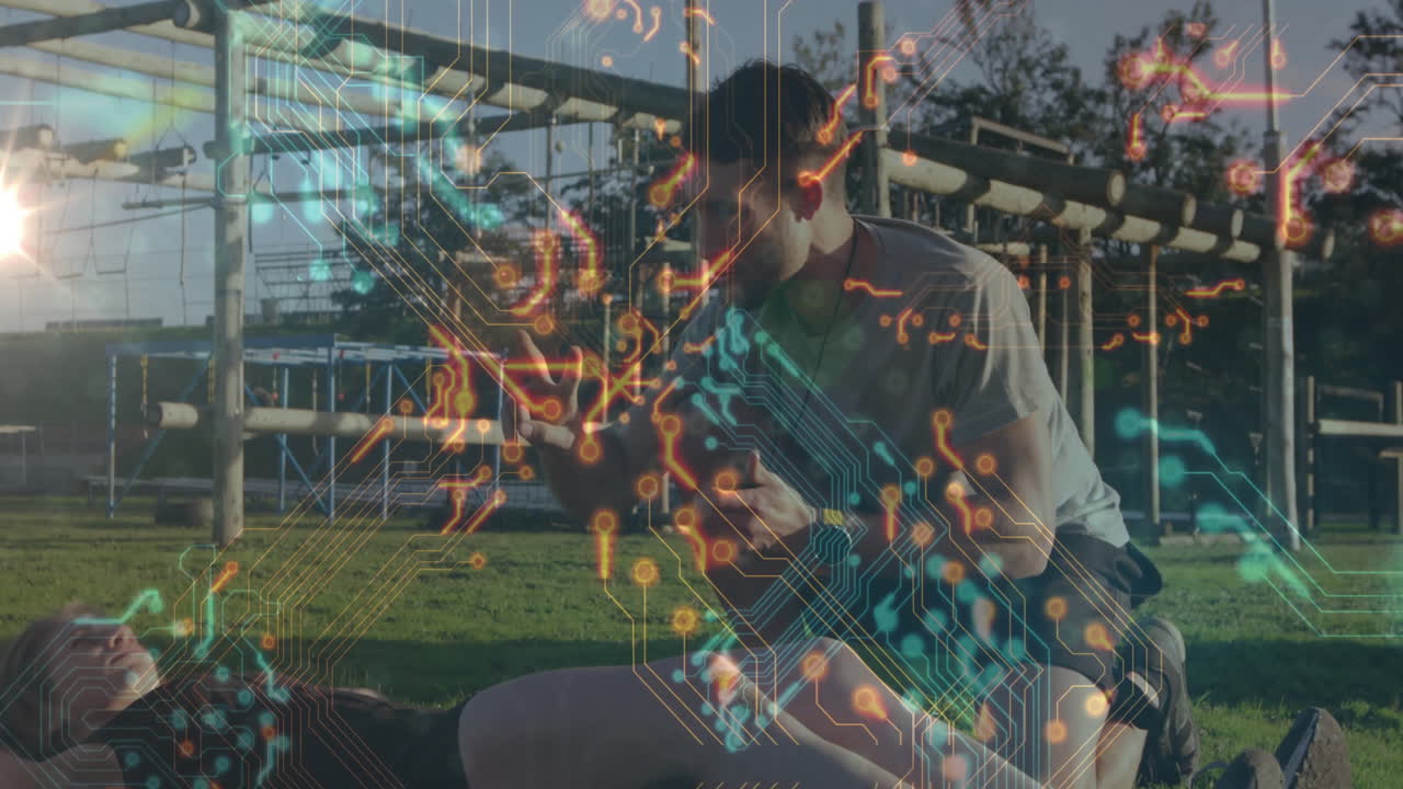 Circuit pattern animation over people exercising outdoors on green grass