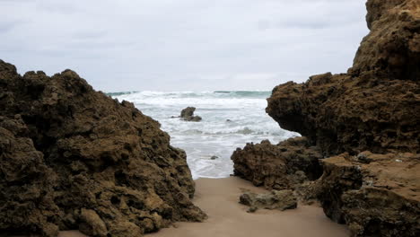 an australian coastal beach with limestone cliffs and formations