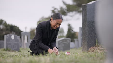 Sad-woman,-graveyard-and-crying-with-rose-by