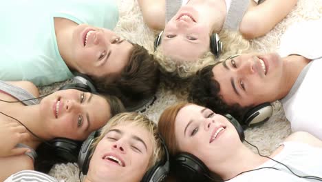 group of teenagers listening to music