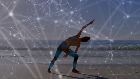 Animation-of-networks-of-connections-over-caucasian-woman-praciticing-yoga-on-beach