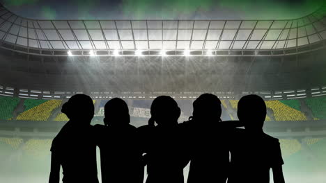 animation of silhouettes of team of sports women with brazilian flag over sports stadium