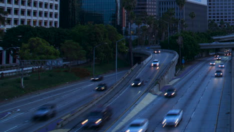 time lapse of oncoming highway traffic at dusk with light trails