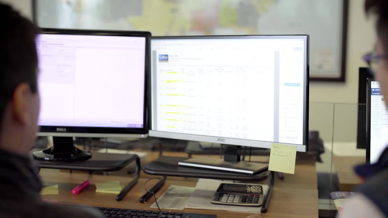 Two people working in an office