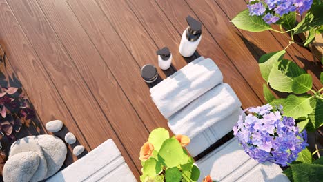 spa wellness setting 2 with flowers, towels, healing rocks, and spa treatment creams on wooden surface, on day time, 3d animation, spa salon treatment, relaxation