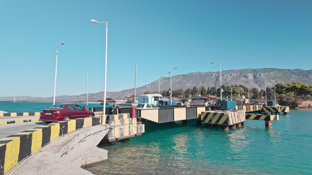 Busy Traffic crossing Corinth canal submersible road bridge