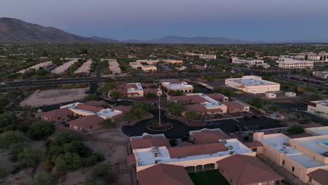 Evening-drone-shot-of-Tuscon-Arizona,-wide-rotating