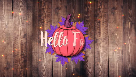 hello fall with pumpkins and autumn leafs on wood