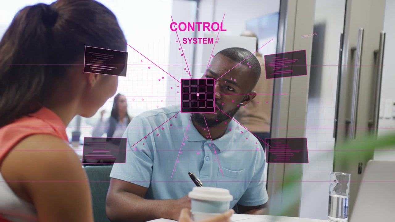 Colleagues at table, square appearing over man expanding into control HUD grid panels for tech demo