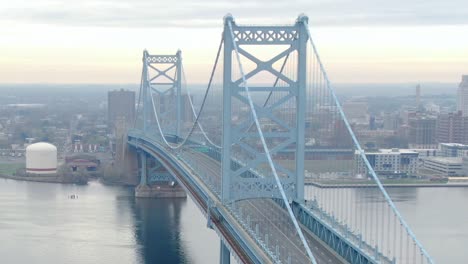 Misty-morning-over-Benjamin-Franklin-suspension-bridge-with-reduced-traffic-during-the-lockdown-2020