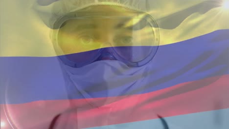 colombian flag waving against female scientist wearing protective clothes