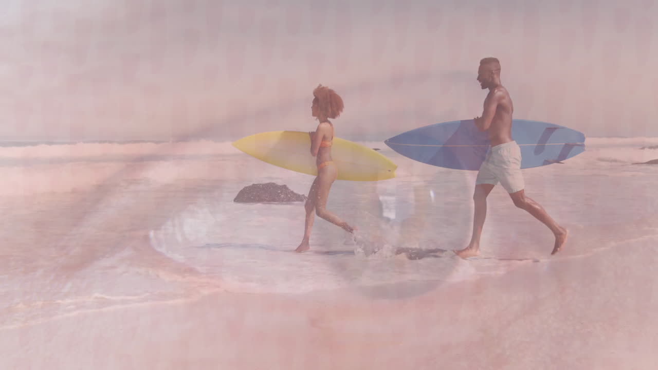 Couple running through shallow waves carrying surfboards at beach, with animated health charts