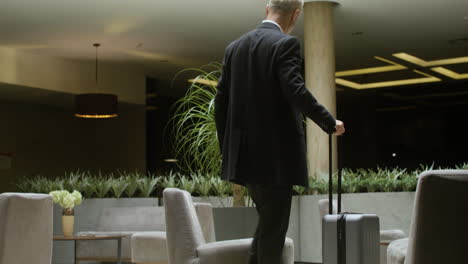 man sitting at the hotel reception desk