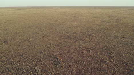 reversing and rising aerial footage of the tanami