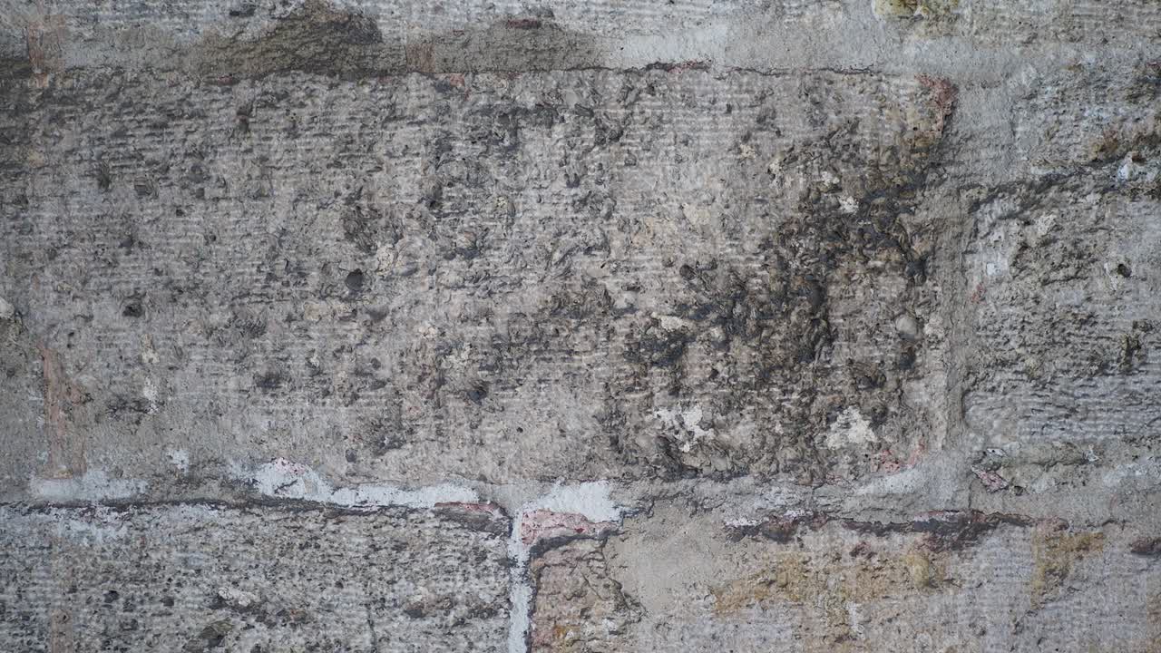 un primer plano de una vieja pared de piedra