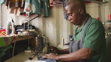 african man sewing tissue