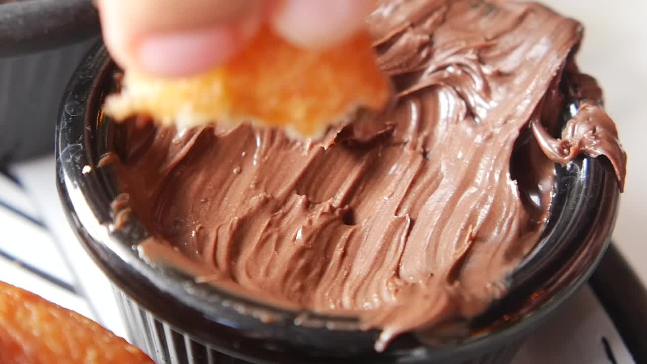 Dipping into Creamy Chocolate Spread