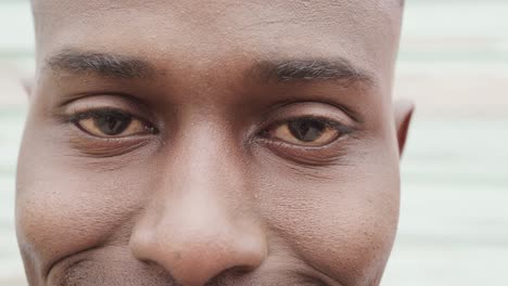 portrait close up of eyes of african american man smiling, slow motion