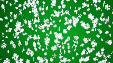los copos de nieve que caen en la pantalla verde