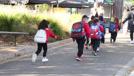 group of kids walking with school bags