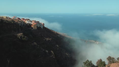 Forwarding-Aerial-Dolly-Shot-of-Beautiful-Village-on-Top-of-Mountain,-Spain