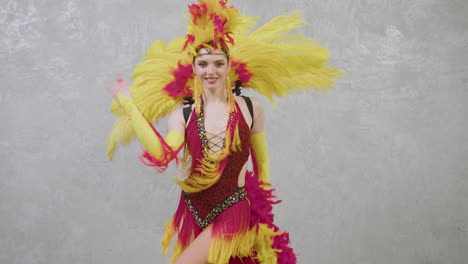 pretty female dancer performing latin dance in colorful dress