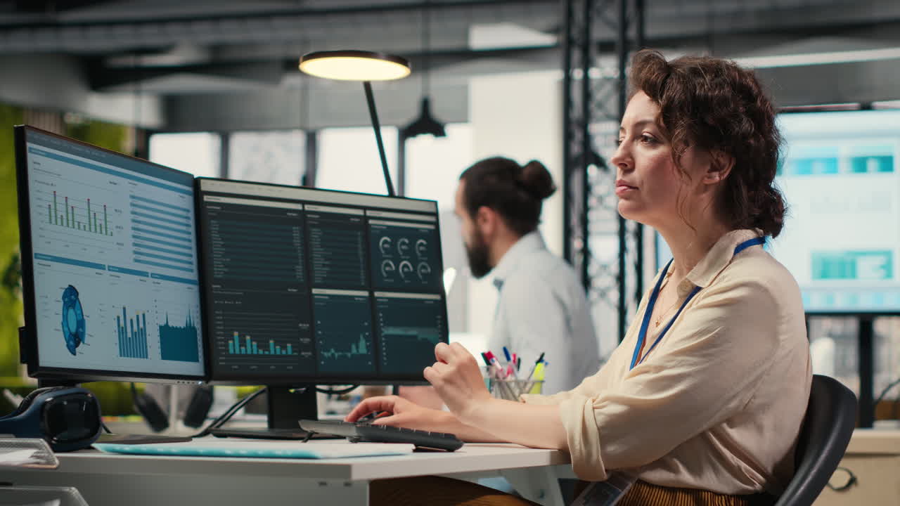 Vertical Video Administrator engages with financial data insights on a computer