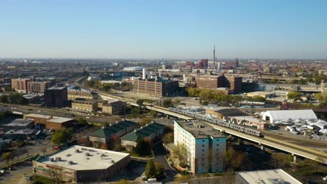 Aerial-Tracking-Shot-of-Elevated-Subway-Train-in-Chicago,-Fall