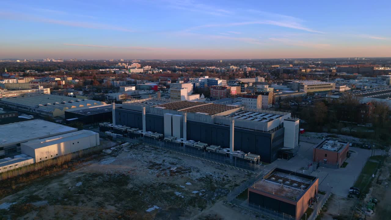Large modern data center building providing essential services for artificial intelligence and cloud computing. Lovely aerial view panorama overview static tripod hovering drone