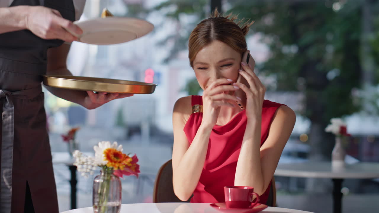 Chic lady talking mobile phone sitting modern cafeteria closeup. Smiling woman