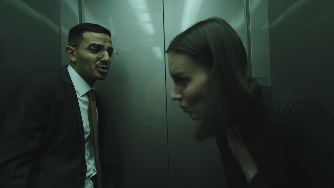 Businesspeople in Elevator Escaping from Zombies