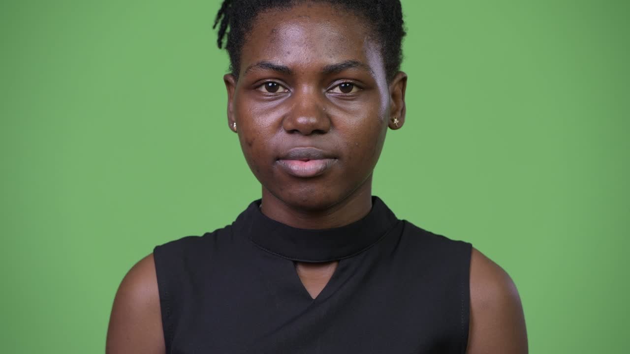 Young beautiful African businesswoman covering mouth as three wise monkeys concept