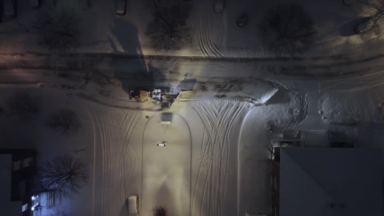 Snowplow operating on roads of Canada during the night