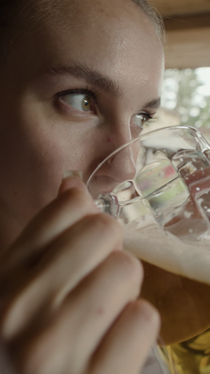A Woman Enjoys a Refreshing Beer