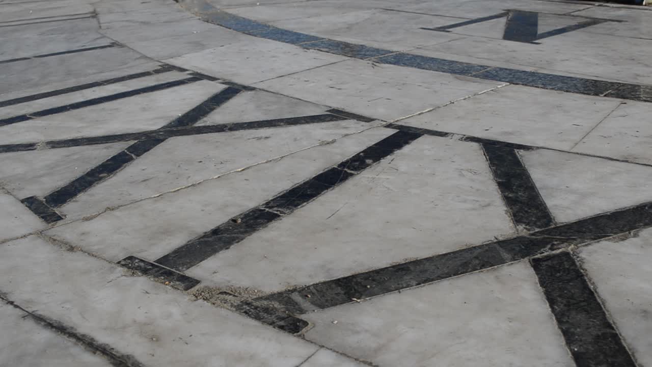 Shooting in the afternoon. Sundial in the city