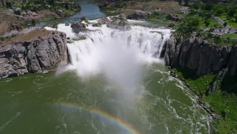 A-4K-drone-shot-of-Shoshone-Falls,-a-raging-waterfall,-which-often-reflects-rainbows,-located-along-the-Snake-River,-only-3-miles-away-from-Perrine-Bridge-and-Twin-Falls,-Idaho