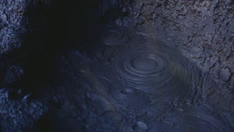 close up of bubbles bursting in mud pool, active geothermal location