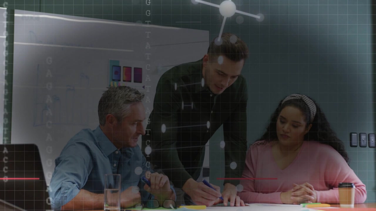 Standing leader leaning in and pointing writing notes for business plan, grid overlay over group