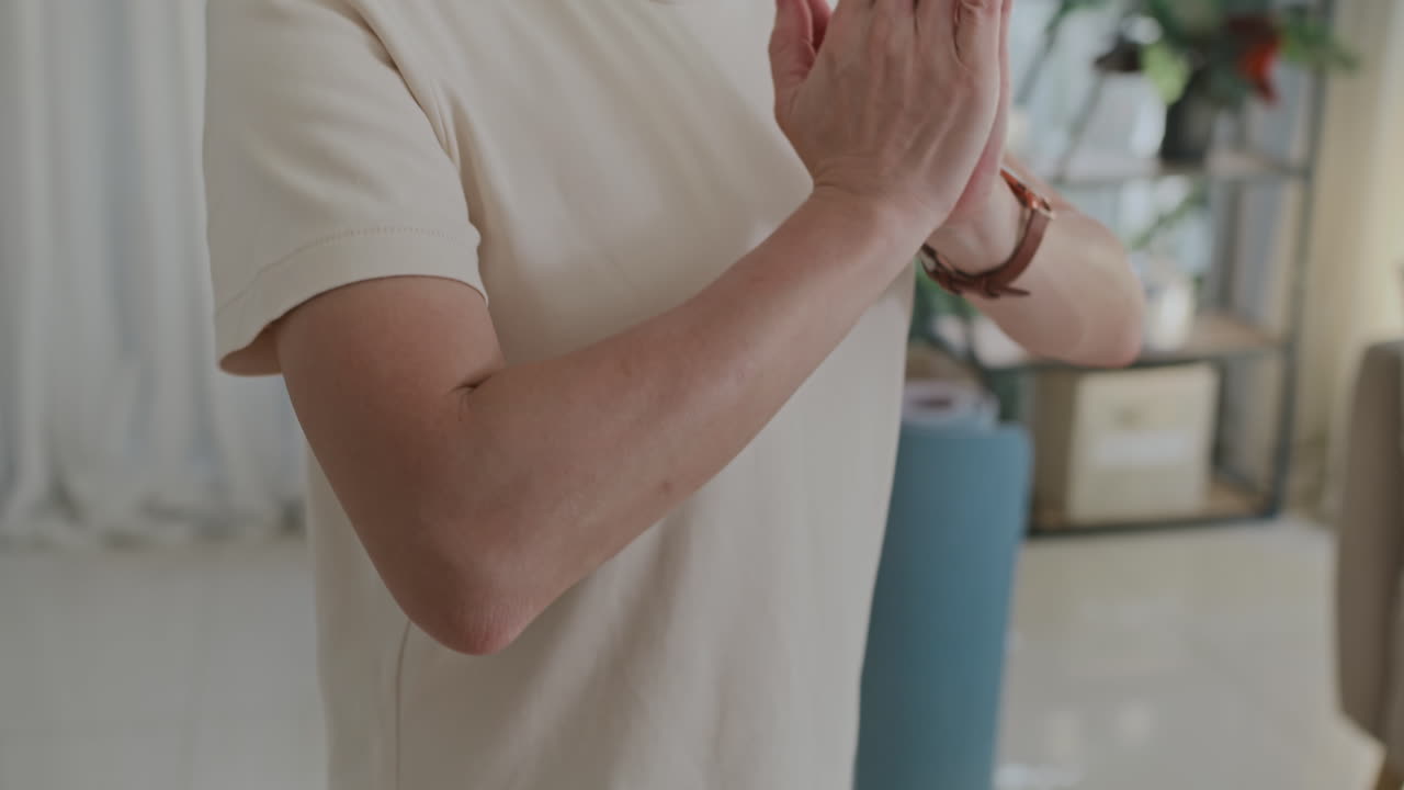Asian Woman Practicing Breathing Exercise during Yoga Class at Home