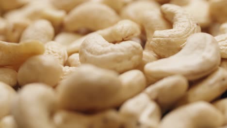 smooth camera movement over a handful of cashew nuts.