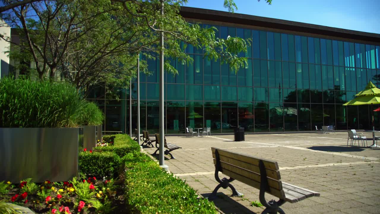 Whitby Public Library Square with Available Seating Outside on Wooden Benches