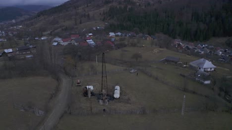 Ariel-drone-footage-of-farms-along-a-hillside