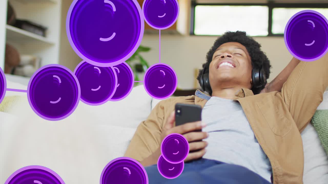 Man reclining on couch, purple nodes sweeping in, revealing phone tapping, relaxing via tech