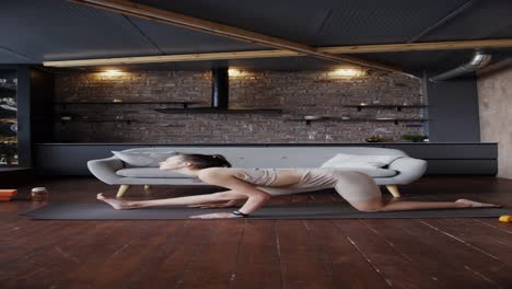 woman doing yoga stretch at home