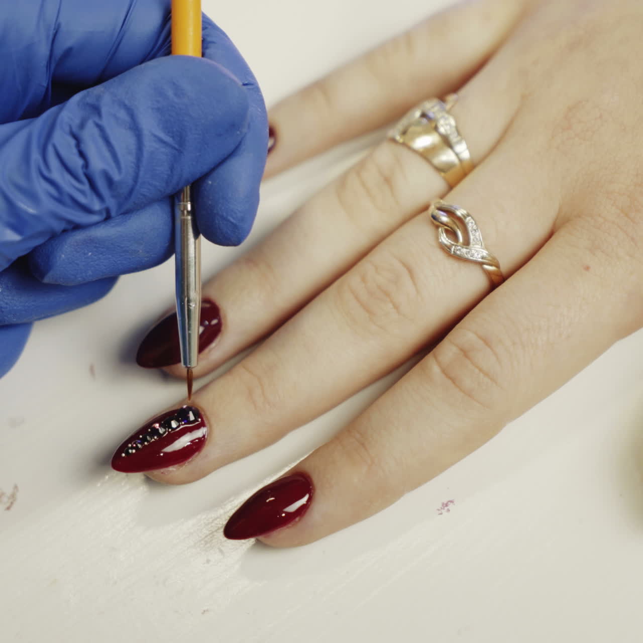 Nail care and manicure. Manicure hand painting of the client's nails. Nail care. Square video