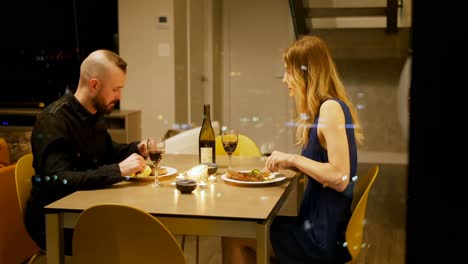 couple interacting with each other while having dinner 4k